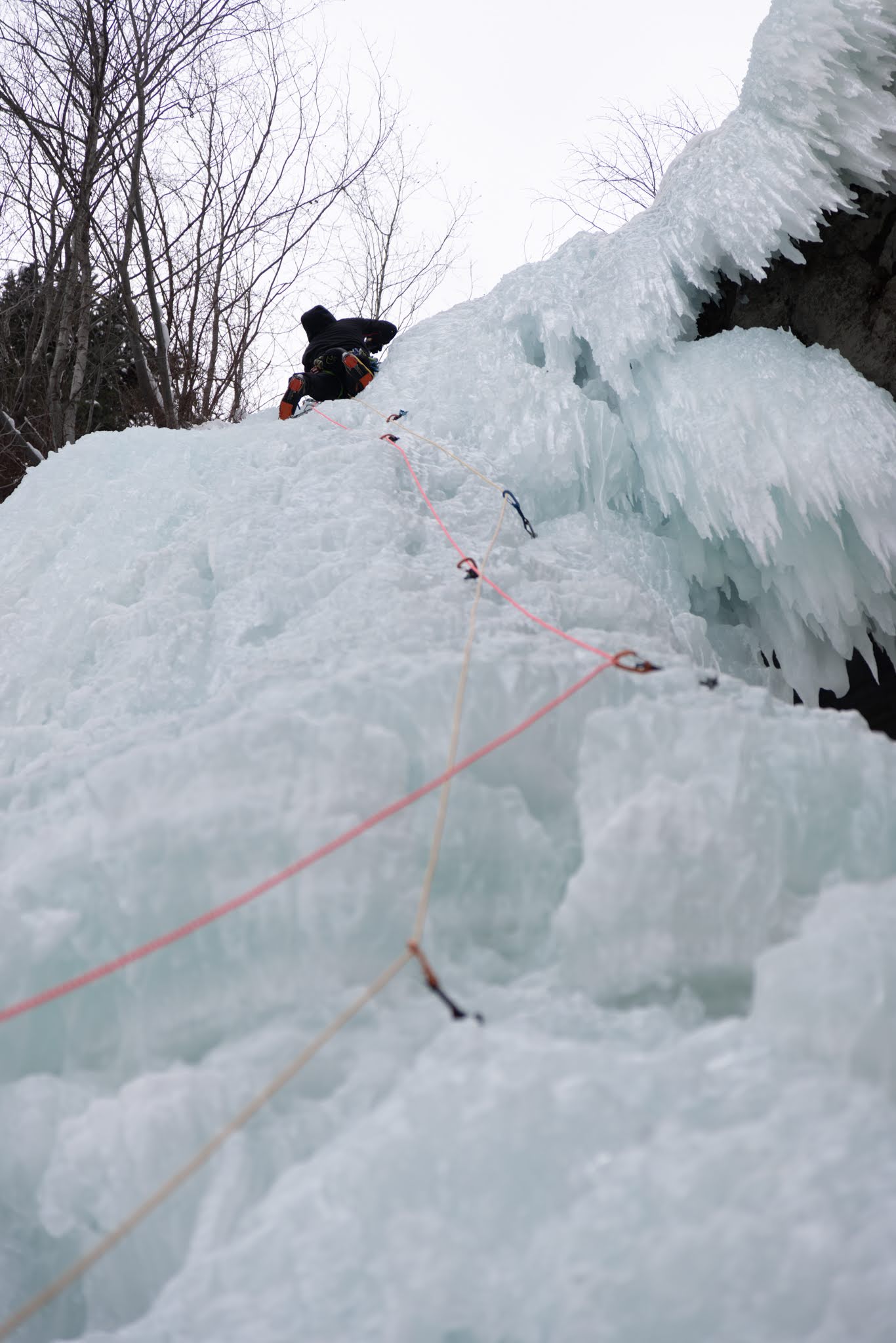 Waterfall Ice Climber nearing the top of a route  in Vail 